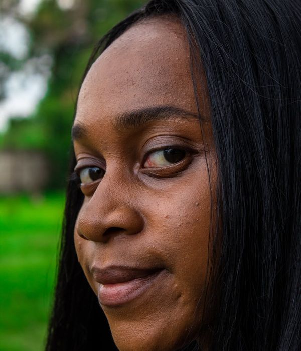 Serene woman looking into the distance with clarity and calm focus.